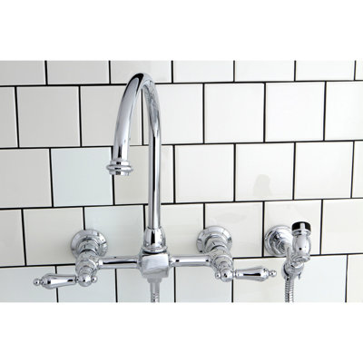 Kingston Brass Restoration Double-Handle 3-Hole Wall-Mount Bridge Kitchen Faucet with Brass Sprayer