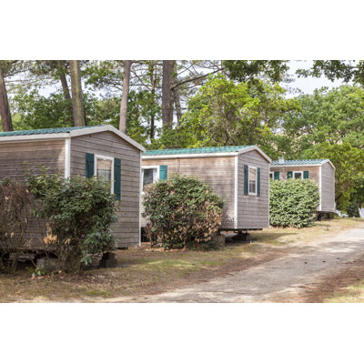 Vacation Homes At A Trailer Park by Typhoonski - Wrapped Canvas Print