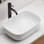 Lavabo vasque ovale moderne en céramique blanche pour meuble-lavabo, durable et facile à nettoyer avec une finition ultrabrillante