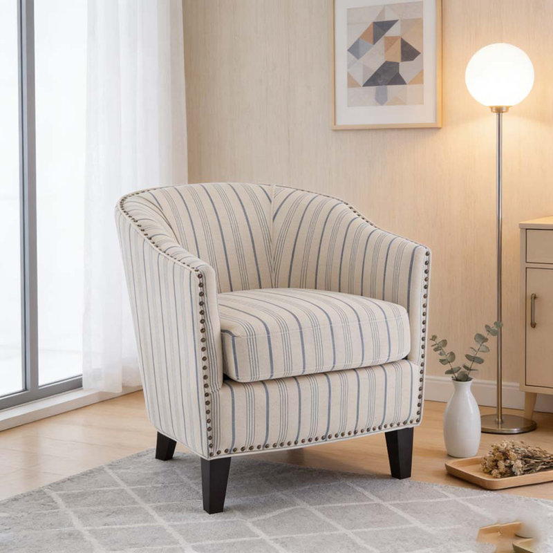 Fauteuil demi-tonneau rembourré à rayures