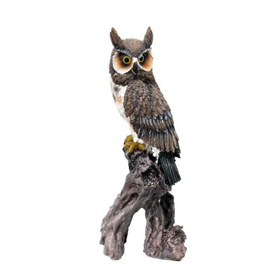 Statuette hibou brun sur une branche