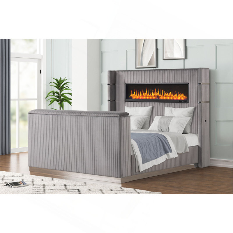 Grand lit avec foyer dans la tête de lit et meuble télé dans le pied de lit en bois gris