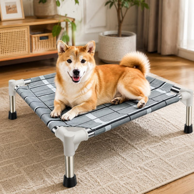 Lit surélevé et rafraîchissant pour petits chiens, doté d'une surface de hamac portable et respirante, d'un cadre en acier inoxydable et de pieds antidérapants pour une utilisation intérieure ou extérieure.