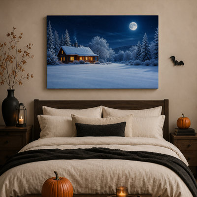Cabane en bois enneigée avec des lumières chaudes aux fenêtres sous une toile murale d'Halloween
