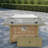 Propane Gas Fire Pit Table With Glass Wind Guard And An Open Basket-wave Patterned Wicker-947424577