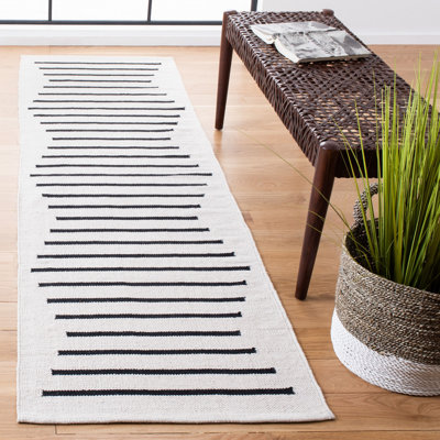 Tapis ivoire / noir en coton fabriqué à la main Mando
