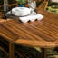 Farsund 6 - Person Teak Solid Wood Patio Dining Set Extendable Oval Table