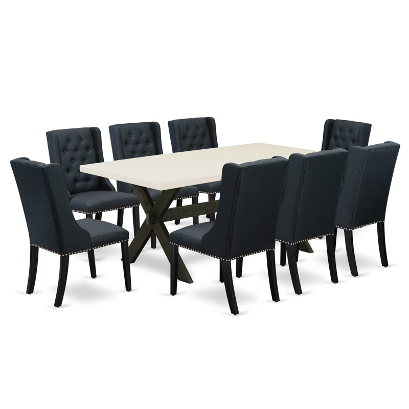 9 Piece Dining Set Includes a Rectangle Dining Room Table with X-Legs and 8 Black Linen Fabric Upholstered Parson Chairs, Wire a brushed Black Finish.