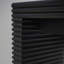 Console moderne noire avec motif nervuré