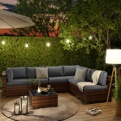 Keyala 7 Piece Rattan Sectional Seating Group with Cushions