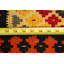Tapis orange / jaune à motif géométrique en laine Aakiyah