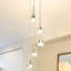 Lustre intégré à DEL réglable en hauteur à 5 lumières avec abat-jour conique Amalfi-65216906