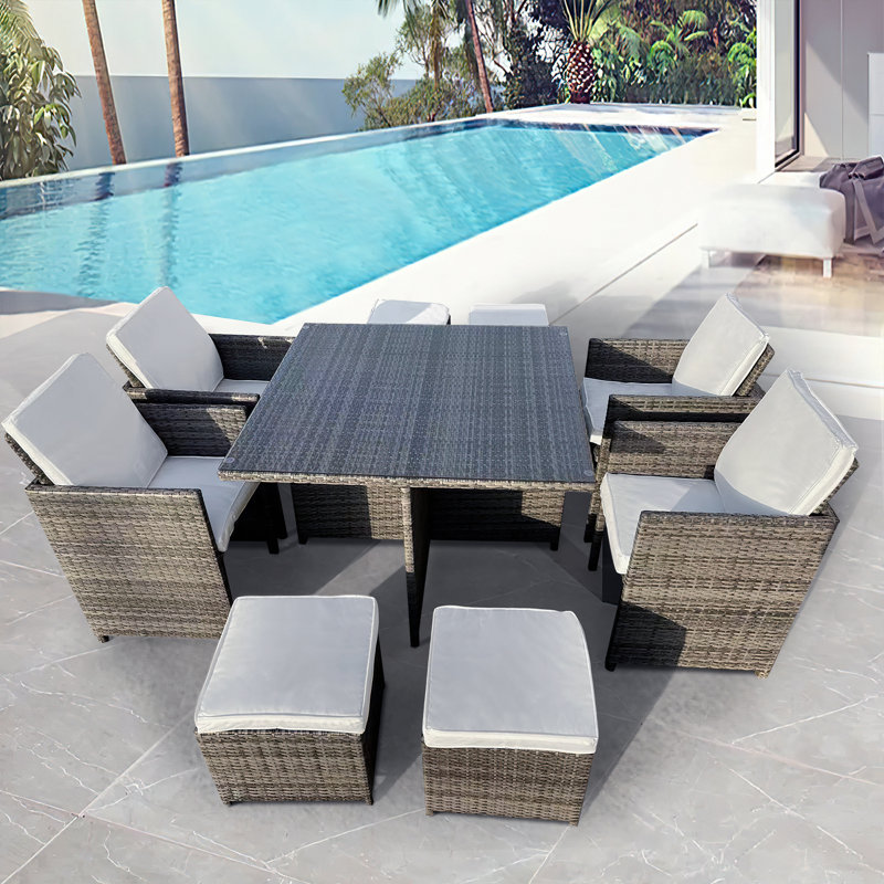Abilio 8 - Person Wicker Patio Dining Set with Square Table , Cushions Included