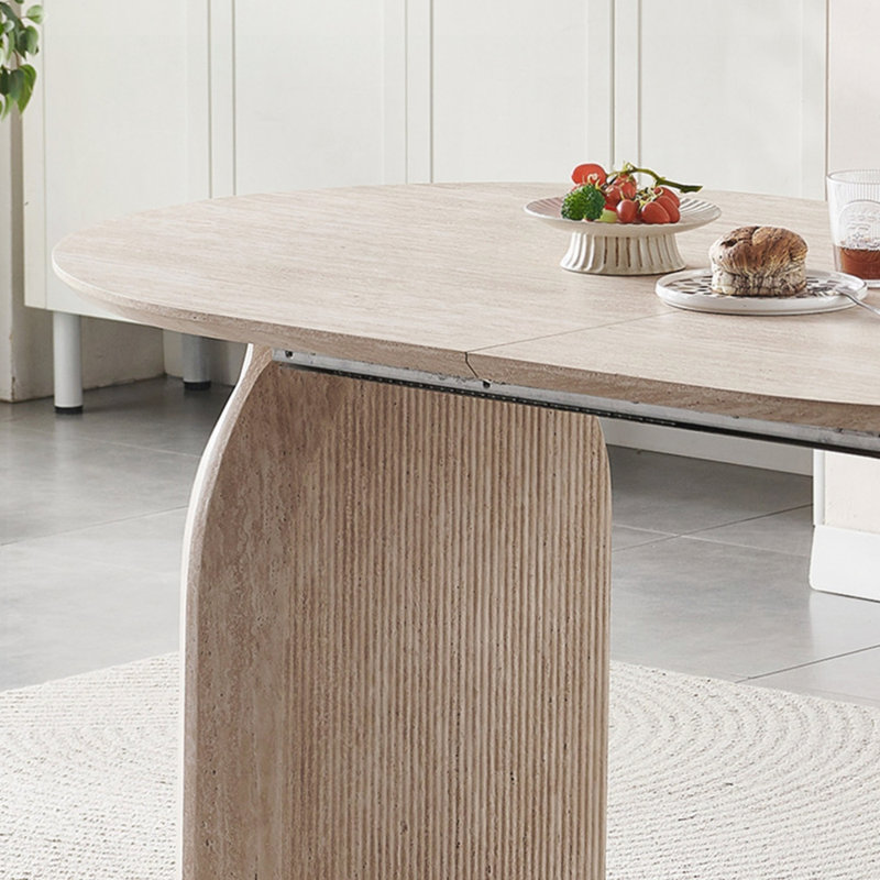 Table de salle à manger elliptique extensible avec pieds incurvés, idéale pour les petits espaces et une décoration polyvalente.