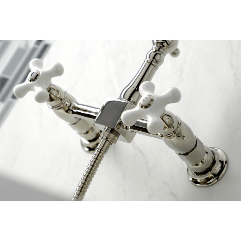Kingston Brass Heritage Double-Handle 3-Hole Wall-Mount Bridge Kitchen Faucet with Brass Sprayer, Polished Nickel