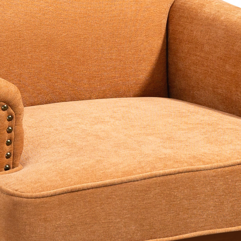 Fauteuil d'appoint. Fauteuil d'appoint à garniture cloutée, idéal pour les chambres à coucher relaxantes