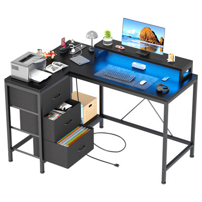Bureau d'ordinateur en forme de L avec prises de courant et lumières DEL, bureau d'angle avec tiroirs et tablettes de rangement, noir