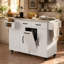 Îlot de cuisine à roulettes inclinable de 51 po avec battant inclinable Calviora-176857887