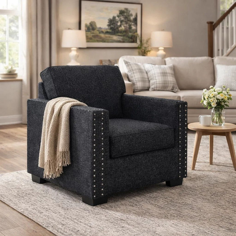 Fauteuil d'appoint Jez, polyester noir charbon avec garniture cloutée, base DEL