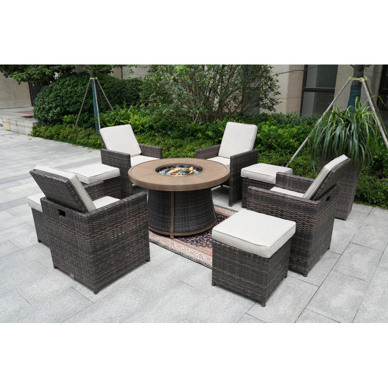 Areefa 8 - Person Wicker Patio Dining Set with Round Table , Cushions Included