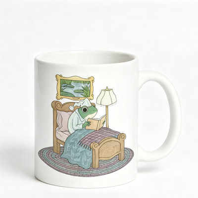 A Comfortable Bedroom Setting Featuring a Frog in Attire on a Ceramic Coffee Mug, Perfect for Tea, Milk.