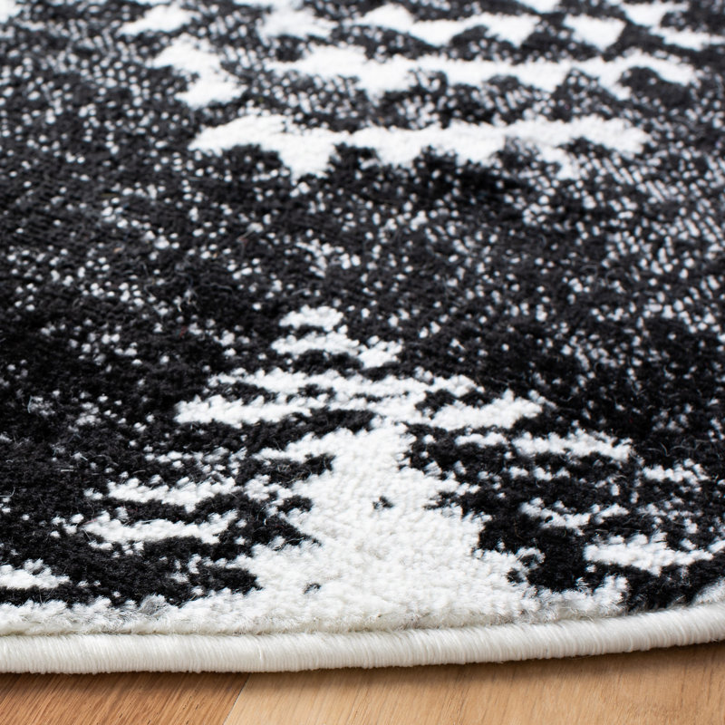 Tapis tissé géométrique noir / ivoire Gonsales, Rond 6 pi 7 po
