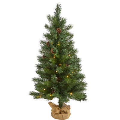 Sapin de Noël vert artificiel avec lumières blanches claires