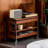Vintage brownish solid wood height - adjustable mobile side table with storage function