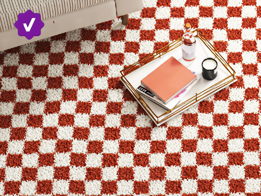 Traditional patterned rug on herringbone wood flooring with Wayfair Verified badge