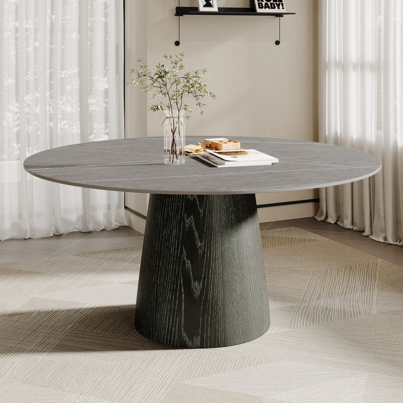 La table de salle à manger moderne en pierre frittée avec piédestal en bois massif optimise l'utilisation de l'espace