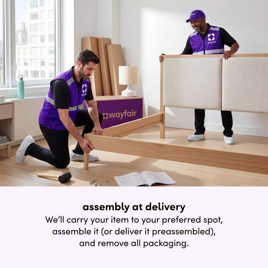 Assembly at delivery: Two Wayfair workers assembling a bed frame inside a customer's home. We'll carry your item to your preferred spot, assemble it or deliver it preassembled, and remove all packaging.