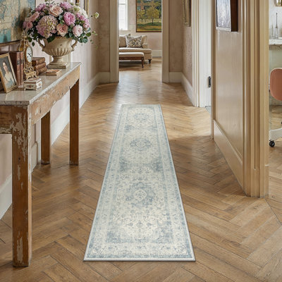 Tapis oriental beige Stella avec envers antidérapant