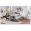 Lit plateforme simple en bois avec bureau et tablette de rangement à l'extrémité du lit-218531241