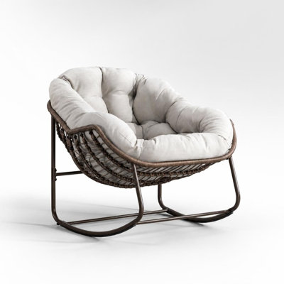 Chaise berçante d'extérieur surdimensionnée en rotin avec coussin rembourré, fauteuil inclinable ergonomique à bascule incurvé, structure en acier thermolaqué robuste, rotin tissé à la main résistant à la décoloration