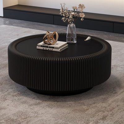 Table basse ronde à cannelures avec plateau en verre trempé