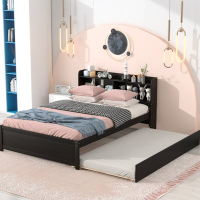 Lit double avec lit gigogne et bibliothèque pour tête de lit, pratique pour les chambres compactes