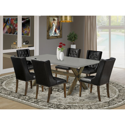 Ensemble de table de salle à manger 7 pièces composé d'une table de salle à manger rectangulaire avec pieds en X et 6 chaises de salle à manger Parson en similicuir noir patiné