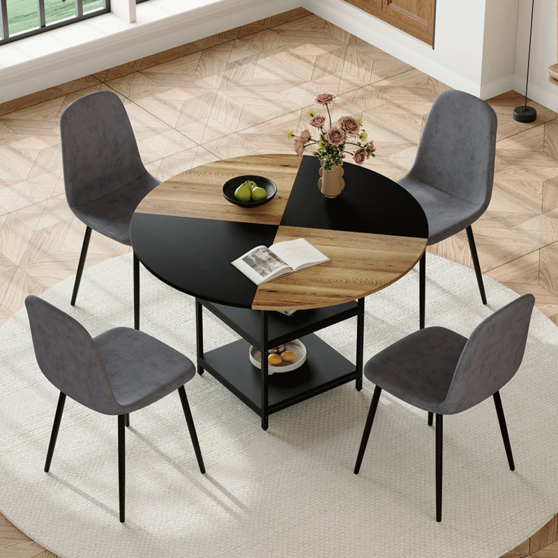 Ensemble de table et de chaises. Une table de salle à manger circulaire épissée de couleur moderne de 47,3 pouces de diamètre - double couche de rangement. Assorti de 4 chaises en tissu de lin gris foncé. Pieds de chaise de pulvérisation en fer