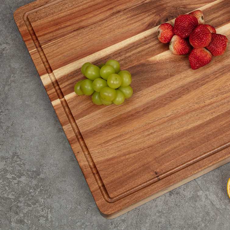 Buy wholesale Rectangular acacia wood cutting board with juice catcher edge  36x28 cm