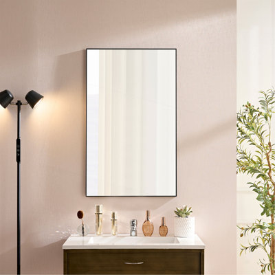 Miroir mural ovale en métal noir