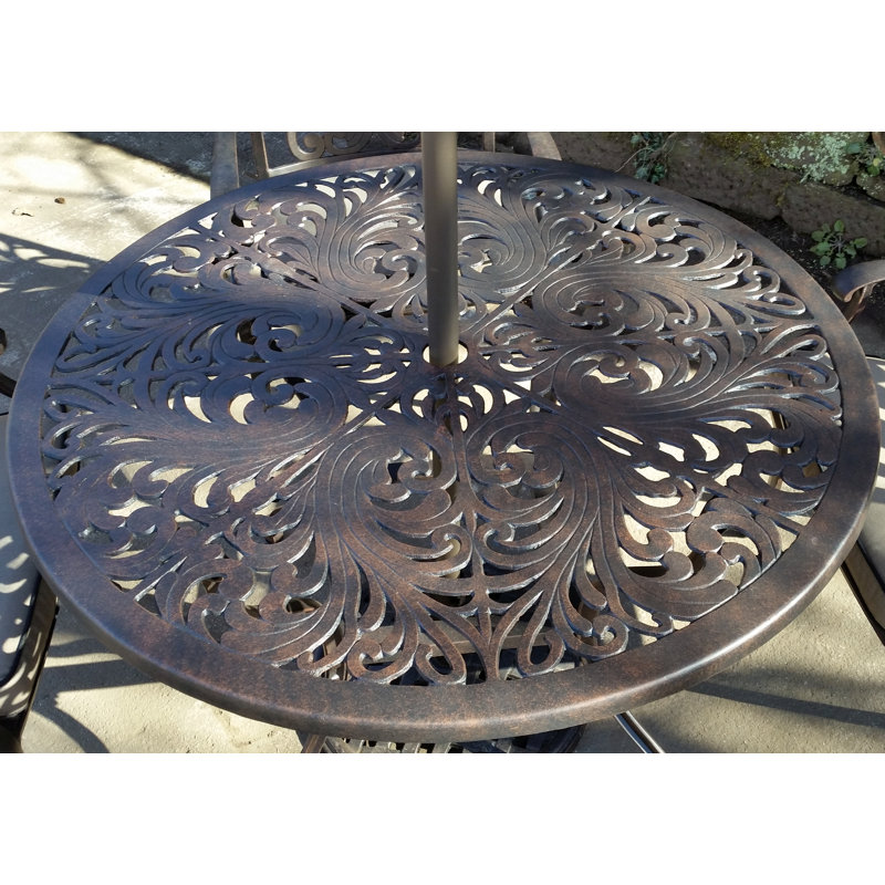Pathard 4 - Person Patio Dining Set with Round Table , Cushions Included