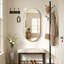 Miroir mural ovale en métal-669632245