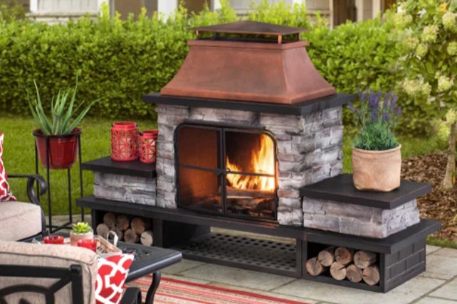 outdoor fireplace with a blazing fire within