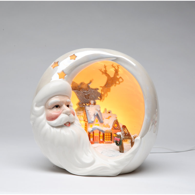 Père Noël avec veilleuse maison de Noël