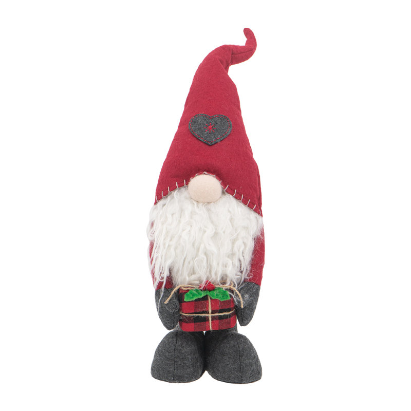 Gnome debout tenant un cadeau