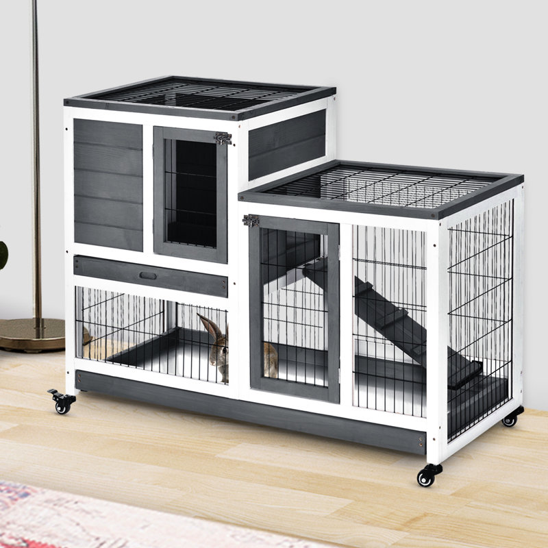 Habitat en bois pour lapin avec enclos fermé et roulettes pratiques