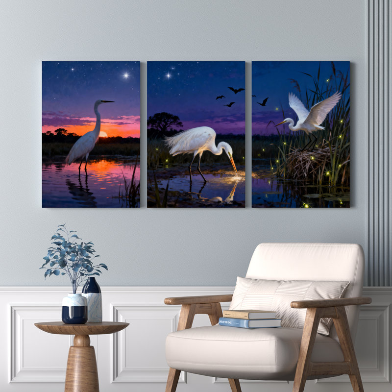 Ensemble de 3 tableaux sur toile tendue représentant un héron blanc au coucher du soleil, H 18 po x l 36 po