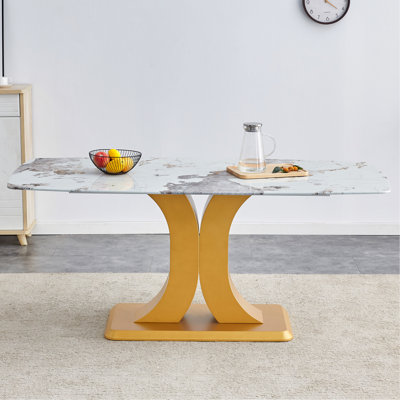 Table de salle à manger luxueuse et moderne en marbre avec piédestal en forme de X et plateau en faux marbre