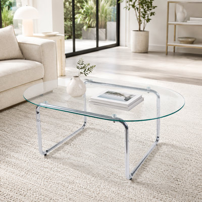 Table basse moderne ovale en verre trempé avec base incurvée en métal chromé
