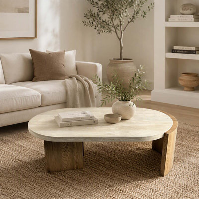 Table basse ovale de 123 cm (48,42 pouces), design moderne avec pieds incurvés en faux bois et plateau texturé imitation travertin, idéale pour le salon.